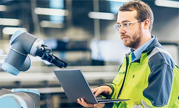 Service technician at work on a production system Service technician at work on a production system